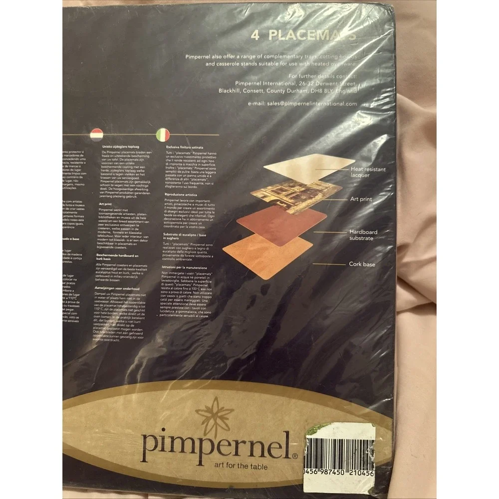 set of four Pimpernel placemats featuring a stylized 